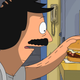 Bob Belcher lovingly pats a burger, featuring a fried egg, cheese, and rashers of bacon.